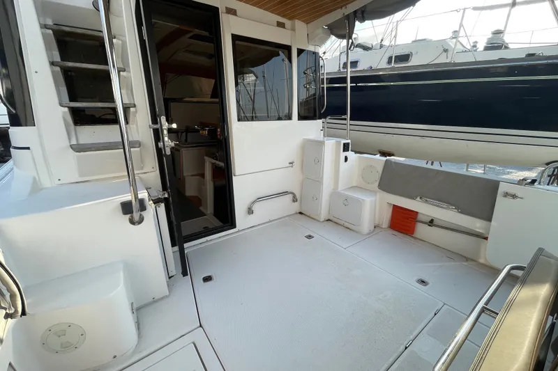 Slide: The Image of 2021 Cutwater C-32 CB boat deck with open cabin door and seating area. - 17