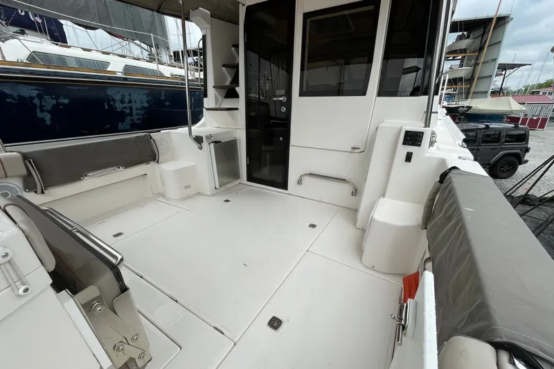 Slide: The Image of 2021 Cutwater C-32 CB boat deck with seating, storage, and access door. - 18