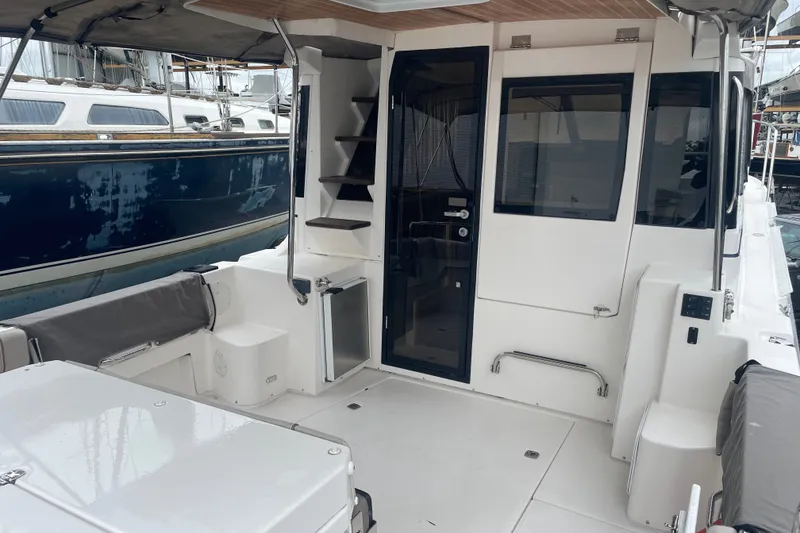 Slide: The Image of 2021 Cutwater C-32 CB boat interior with seating, stairs, and glass door. - 22