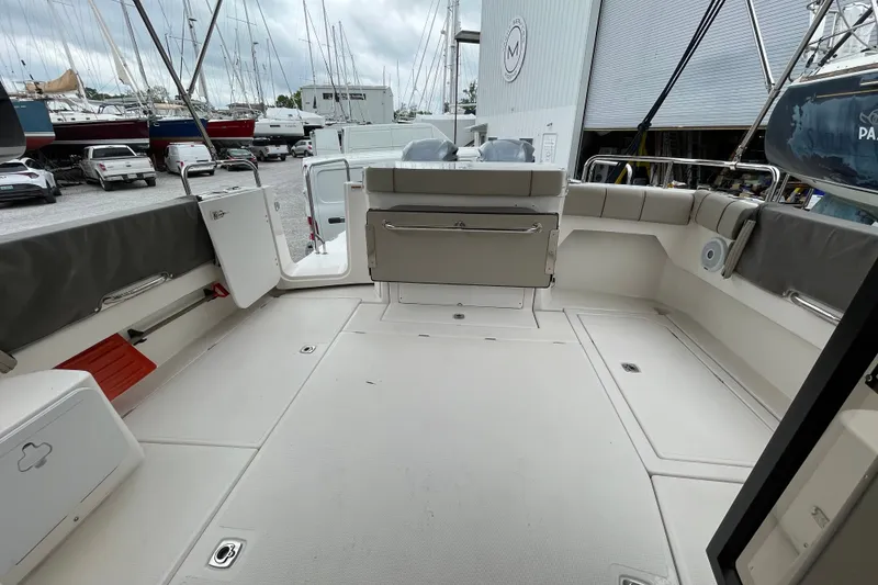 Slide: The Image of 2021 Cutwater C-32 CB boat deck with seating, docked at marina. - 23