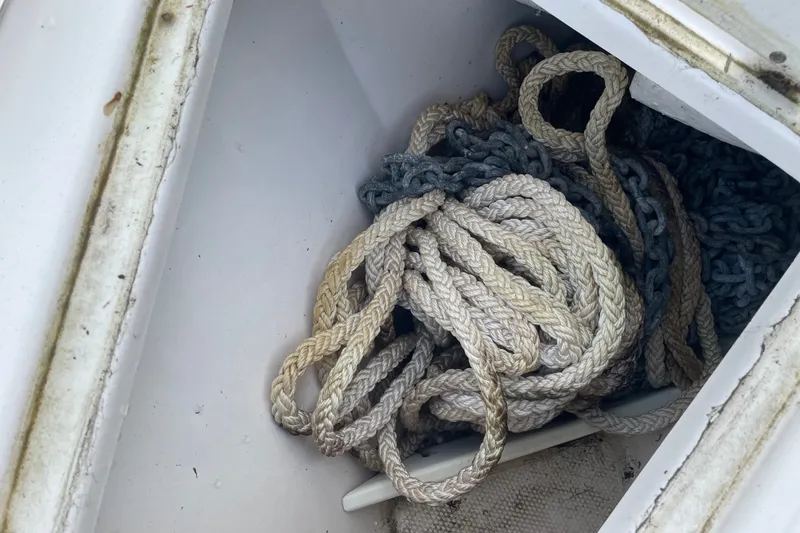 Slide: The Image of Rope and chain storage in 2021 Cutwater C-32 CB boat compartment. - 27