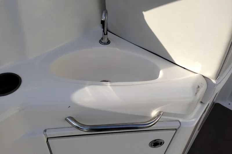 Slide: The Image of 2005 Bayliner 305 boat sink with chrome faucet and handle. - 14