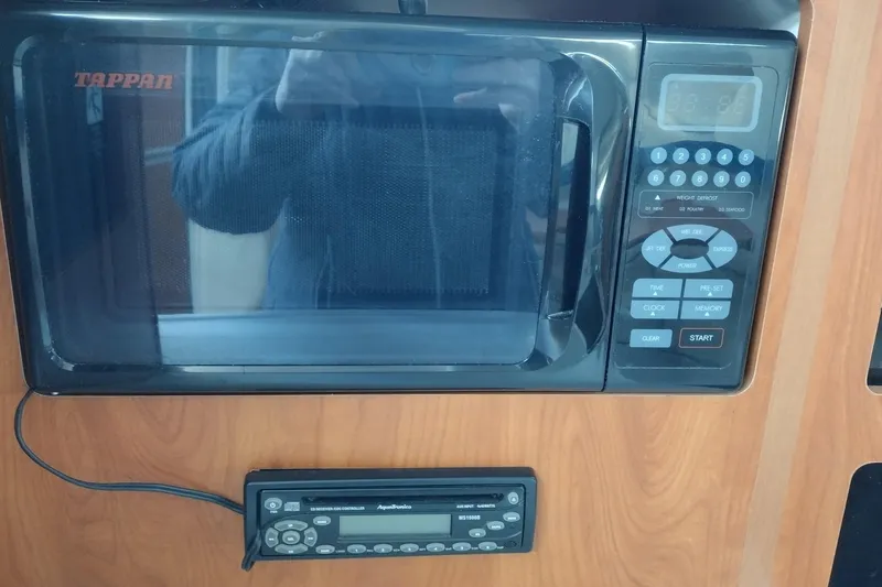 Slide: The Image of Tappan microwave and Aquatronics radio in 2005 Bayliner 305 boat interior. - 19