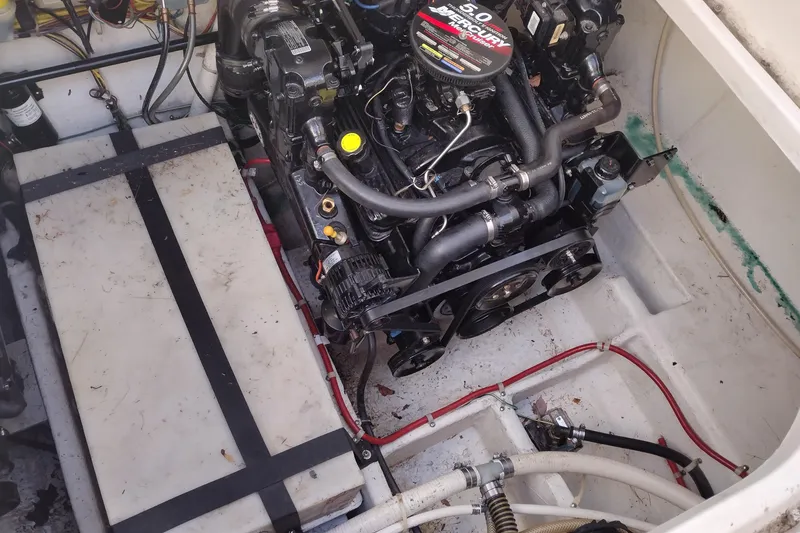 Slide: The Image of Engine compartment of a 2005 Bayliner 305 boat with Mercury 5.0 engine. - 38