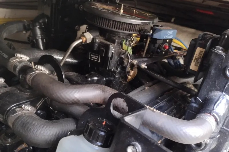 Slide: The Image of Engine compartment of a 2005 Bayliner 305 boat, showing hoses and mechanical components. - 40