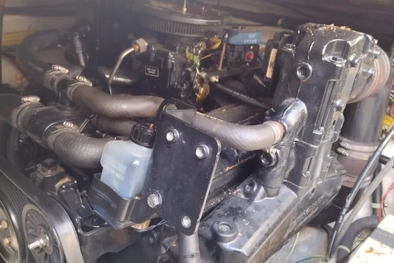 Slide: The Image of Engine compartment of a 2005 Bayliner 305 boat, showcasing hoses and components. - 41