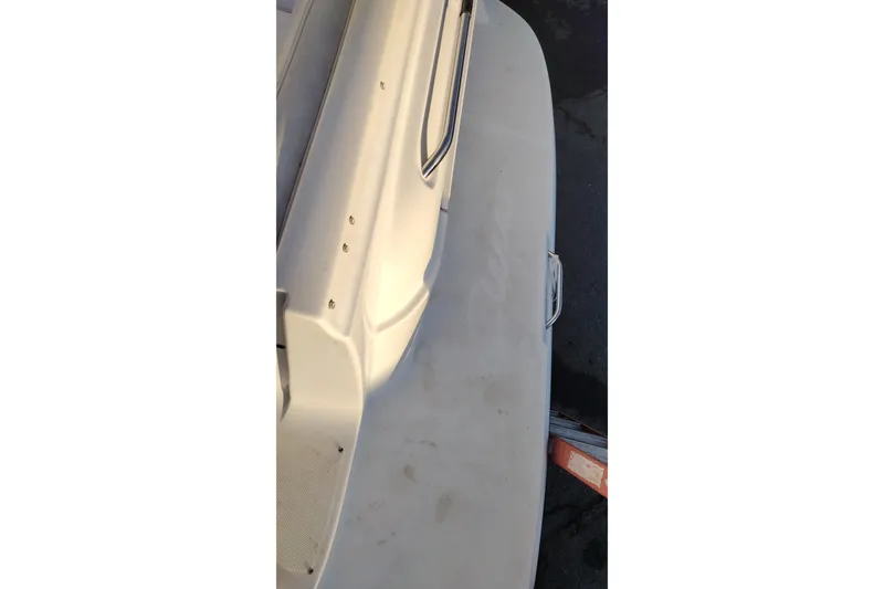 Slide: The Image of 2005 Bayliner 305 boat deck with railing and swim platform. - 46