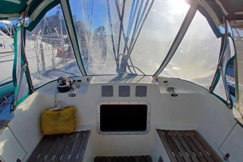 Slide: The Image of Cockpit view of 1983 Wauquiez Hood sailboat with clear canopy and seating. - 2