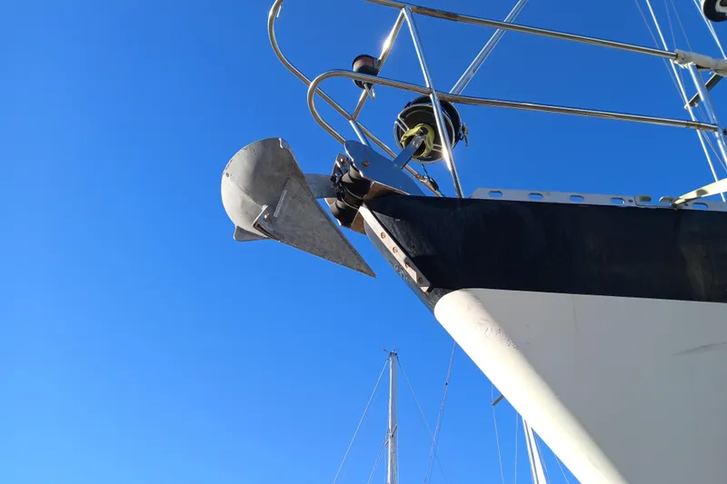 Slide: The Image of 1983 Wauquiez Hood yacht bow with anchor against clear blue sky. - 42
