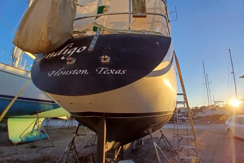 Slide: The Image of 1983 Wauquiez Hood sailboat in dry dock, Houston, Texas, at sunset. - 54