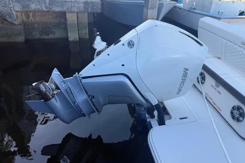 Slide: The Image of 2022 Sea Ray SDX 250 with Mercury outboard engine, docked in a marina. - 4