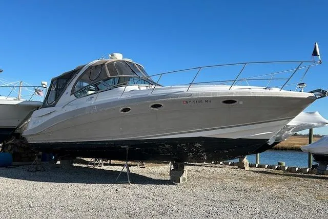 The Image of 2007 Four Winns 358 Vista boat on dry dock under clear blue sky. - 0