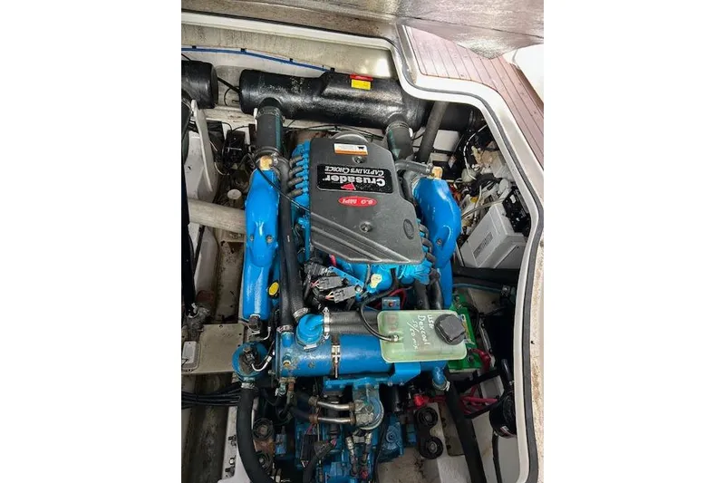 Slide: The Image of Engine compartment of 2007 Four Winns 358 Vista boat, featuring Crusader engine. - 12