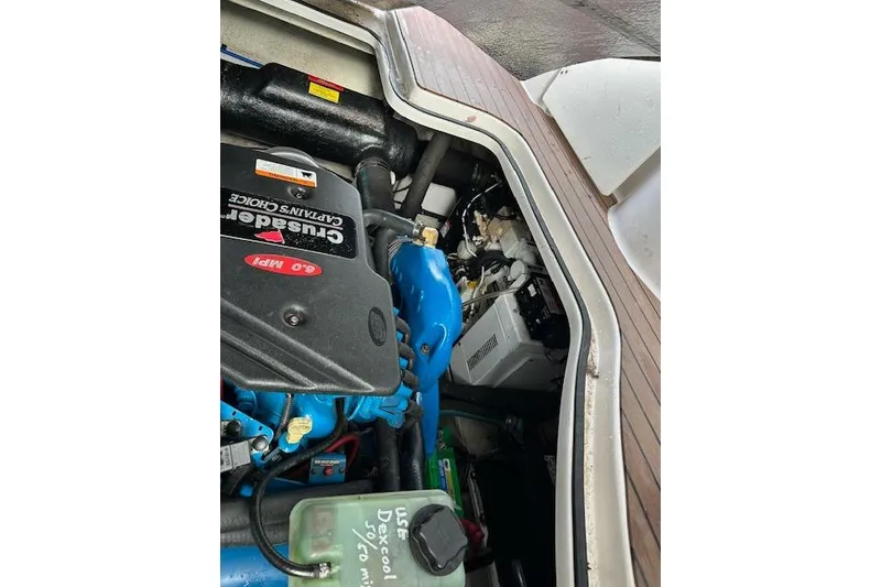 Slide: The Image of Engine compartment of 2007 Four Winns 358 Vista boat, featuring Crusader 6.0 MPI engine. - 13