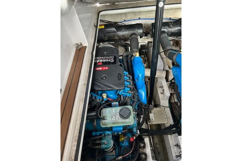 Slide: The Image of Engine compartment of a 2007 Four Winns 358 Vista boat, featuring Crusader 6.0 MPI engine. - 8