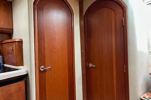 Slide: The Image of Interior of 2007 Four Winns 358 Vista yacht with wooden doors and cabinetry. - 9