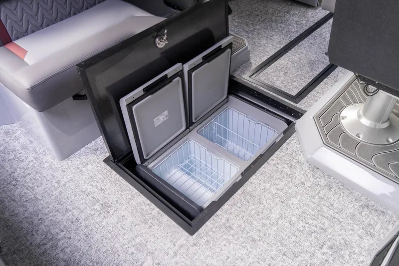 Slide: The Image of Manufacturer Provided Image: Underfloor storage compartments in 2026 Revel RS25L vehicle interior. - 11