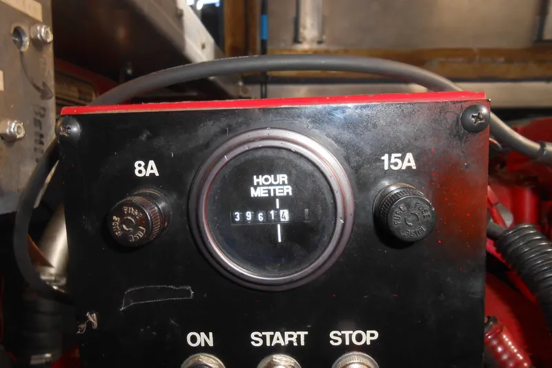 Slide: The Image of Control panel of a 1991 Stardust Cruisers 7516 with hour meter reading 3961.4. - 27