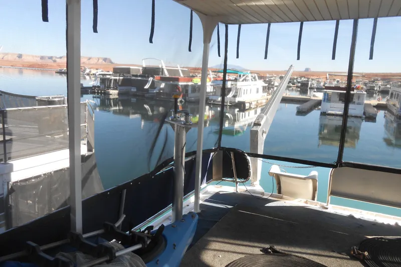 Slide: The Image of Houseboat interior view at marina, Stardust Cruisers 7516, 1991 model, calm water reflections. - 30
