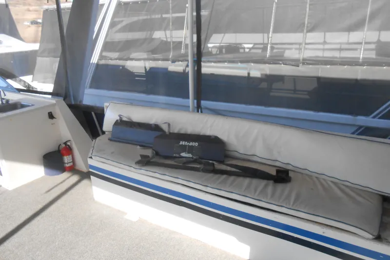 Slide: The Image of Interior of 1991 Stardust Cruisers 7516 with seating and a fire extinguisher. - 32