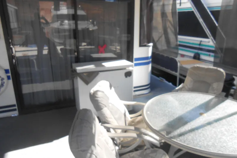 Slide: The Image of Outdoor seating area on a 1991 Stardust Cruisers 7516 houseboat. - 38