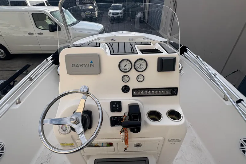 Slide: The Image of 2021 Tidewater 198 CC Adventure boat dashboard with Garmin navigation system and controls. - 11