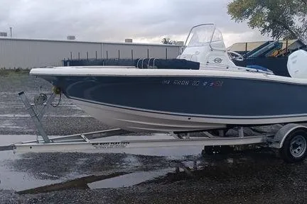 Slide: The Image of 2021 Tidewater 198 CC Adventure boat on trailer in outdoor setting. - 3