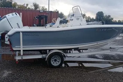 Slide: The Image of 2021 Tidewater 198 CC Adventure boat on trailer, parked outdoors. - 4