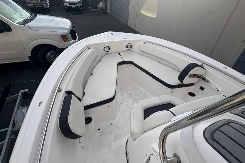 Slide: The Image of 2021 Tidewater 198 CC Adventure boat interior with white seating and black accents. - 7