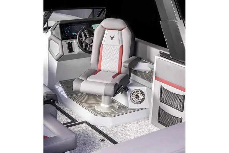 Slide: The Image of Manufacturer Provided Image: 2026 Revel RS25L boat interior with modern helm, luxurious captain's chair, and advanced dashboard. - 10