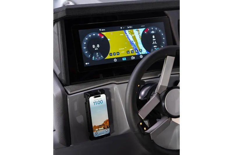 Slide: The Image of Manufacturer Provided Image: 2026 Revel RS25L dashboard with digital display and smartphone holder. - 13