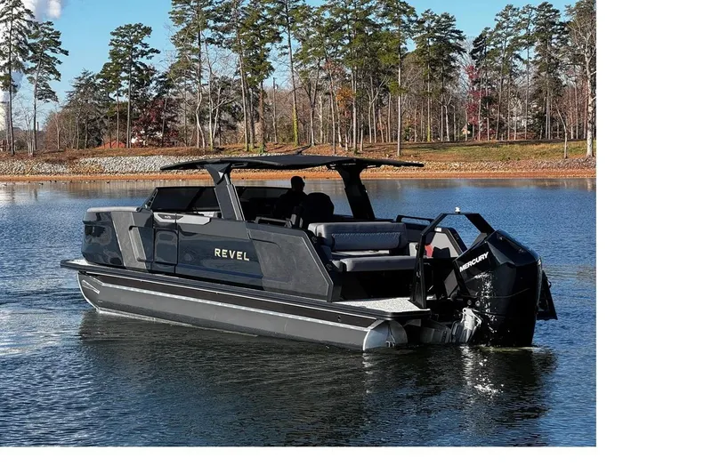 Slide: The Image of 2026 Revel RS25L luxury pontoon boat on a serene lake. - 2