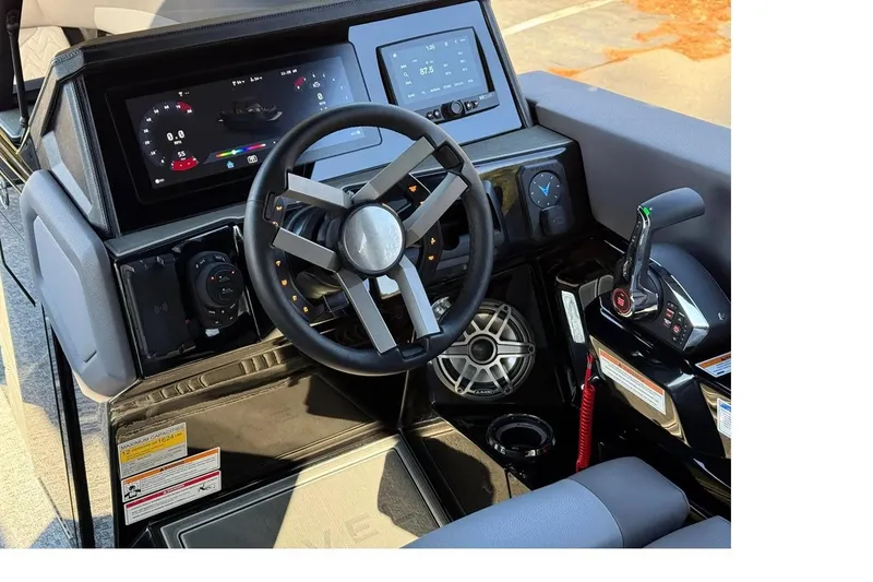 Slide: The Image of 2026 Revel RS25L luxury boat on a serene lake with trees in the background. - 4