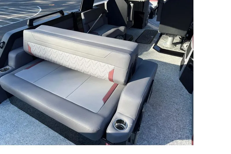 Slide: The Image of 2026 Revel RS25L boat dashboard with modern steering wheel and digital controls. - 5