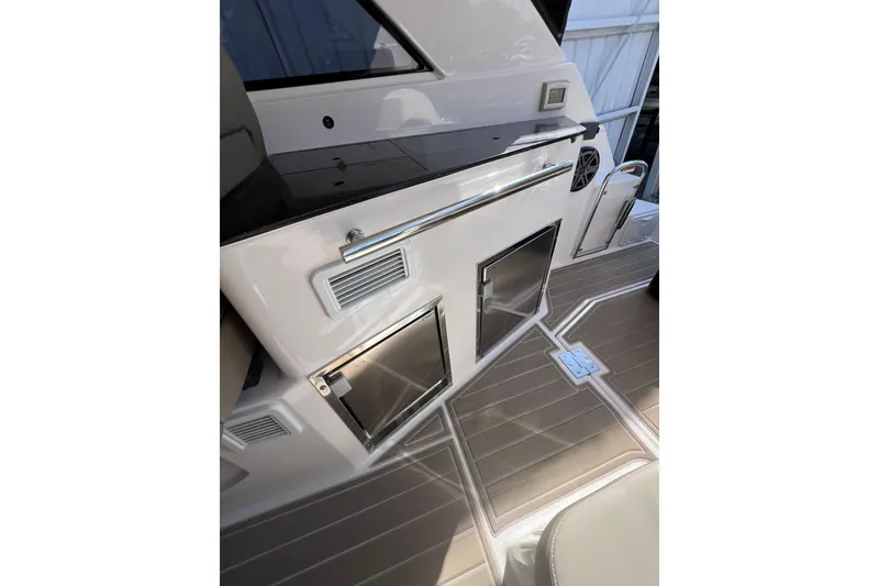 Slide: The Image of 2015 Regal 35 Sport Coupe interior with sleek cabinetry and modern flooring. - 11