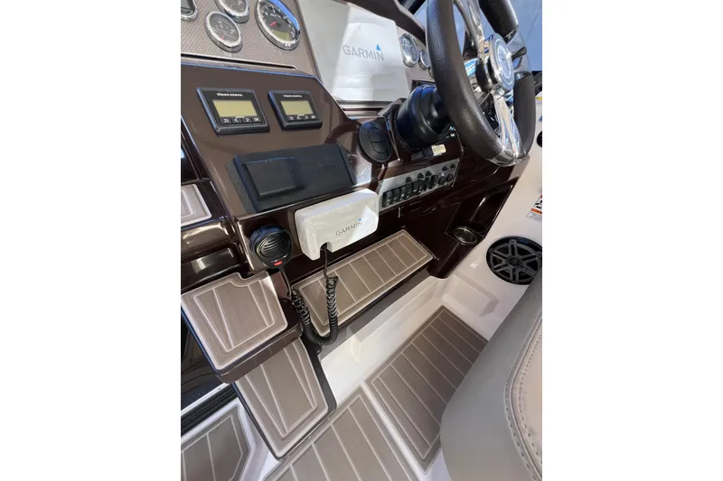 Slide: The Image of 2015 Regal 35 Sport Coupe dashboard with Garmin navigation and control panels. - 15