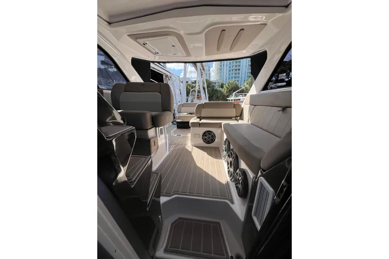 Slide: The Image of Interior of 2015 Regal 35 Sport Coupe yacht with modern seating and speakers. - 18