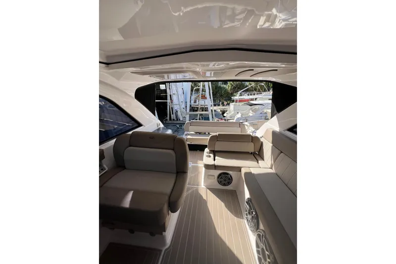 Slide: The Image of 2015 Regal 35 Sport Coupe interior with beige seating and modern design. - 19