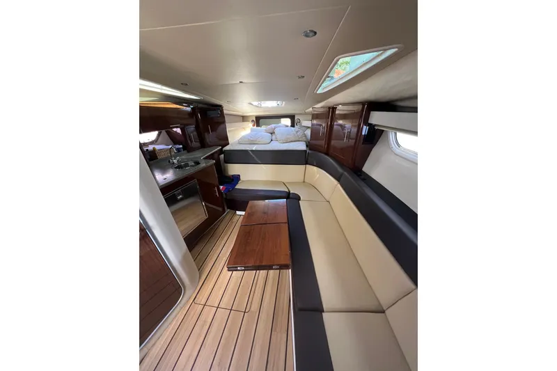 Slide: The Image of Luxurious interior of 2015 Regal 35 Sport Coupe with seating and kitchenette. - 21