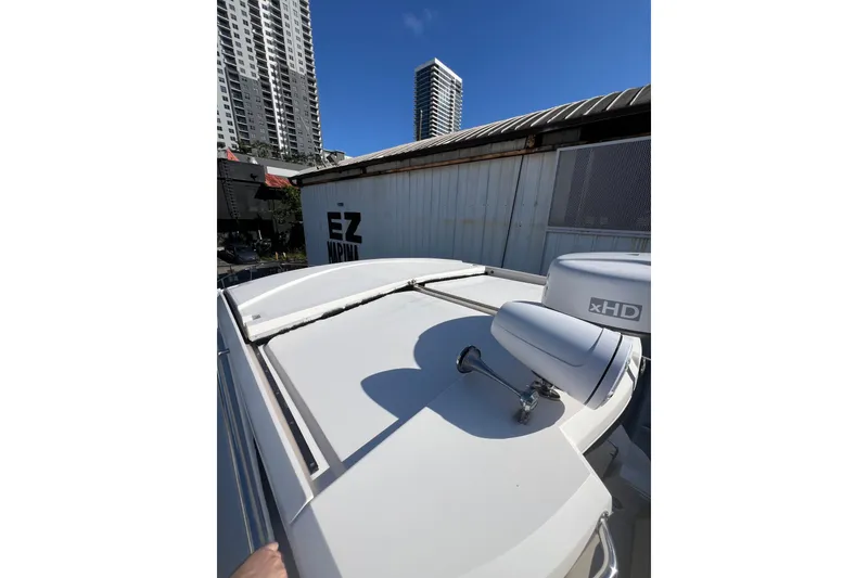 Slide: The Image of 2015 Regal 35 Sport Coupe boat rooftop with radar, urban skyline background. - 25