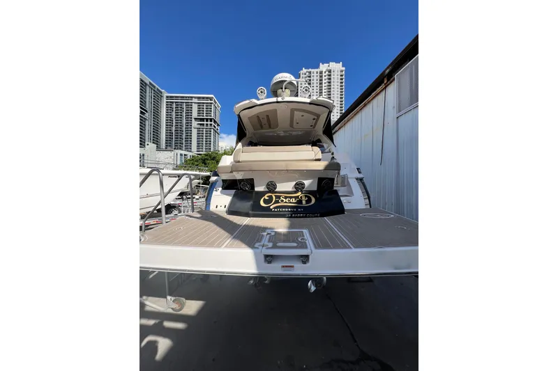 Slide: The Image of 2015 Regal 35 Sport Coupe yacht docked with city skyline background. - 3