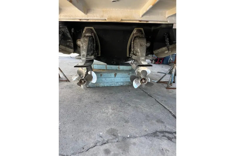 Slide: The Image of 2015 Regal 35 Sport Coupe boat propellers on dry dock. - 33