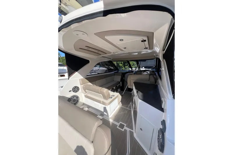 Slide: The Image of 2015 Regal 35 Sport Coupe interior with seating and helm, showcasing luxury design. - 8