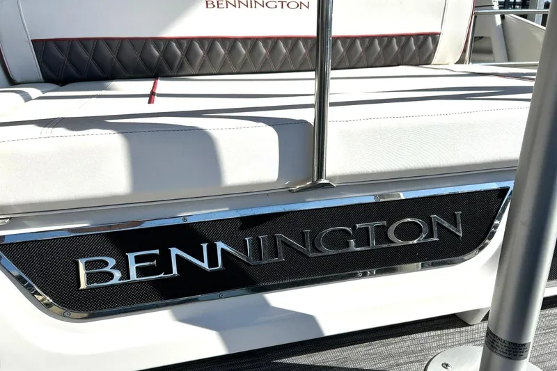 Slide: The Image of 2021 Bennington 25 RXSBA boat interior with logo and seating detail. - 28