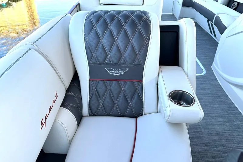 Slide: The Image of Luxurious seating on 2021 Bennington 25 RXSBA boat with diamond-stitched upholstery and cup holder. - 35