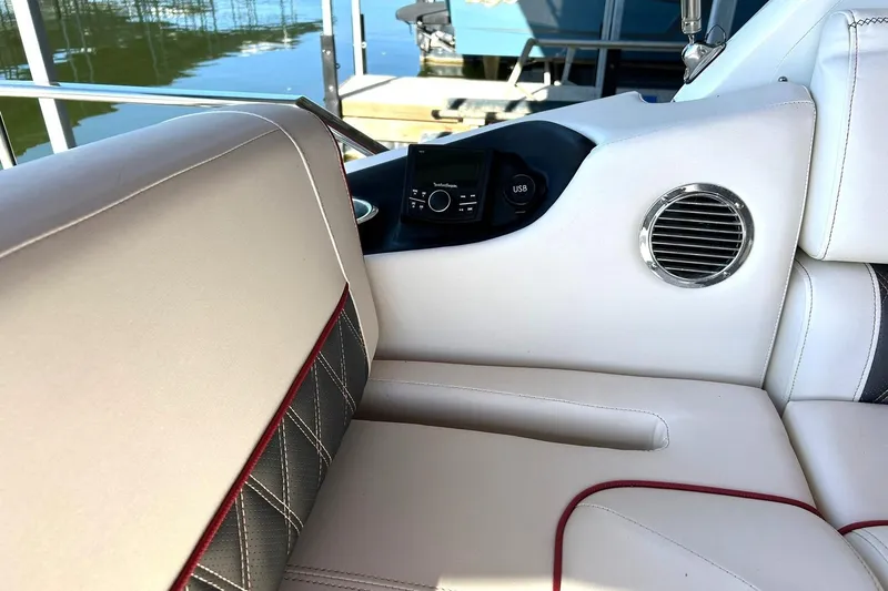 Slide: The Image of Luxurious interior of 2021 Bennington 25 RXSBA boat with plush seating and audio system. - 37