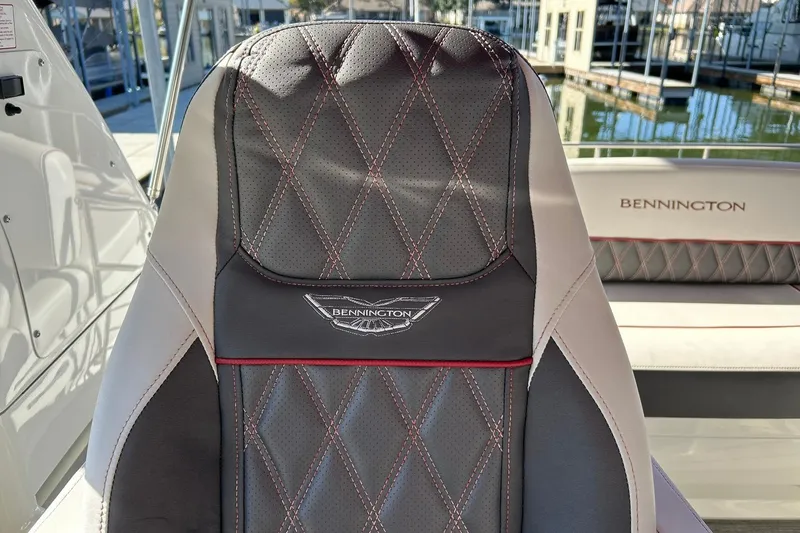 Slide: The Image of 2021 Bennington 25 RXSBA boat seat with diamond stitching and logo detail. - 39