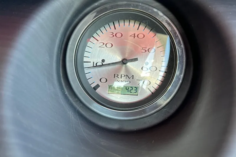 Slide: The Image of Close-up of a 2021 Bennington 25 RXSBA RPM gauge displaying 42.3. - 41