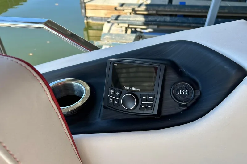 Slide: The Image of Control panel of 2021 Bennington 25 RXSBA boat with USB port and audio system. - 50