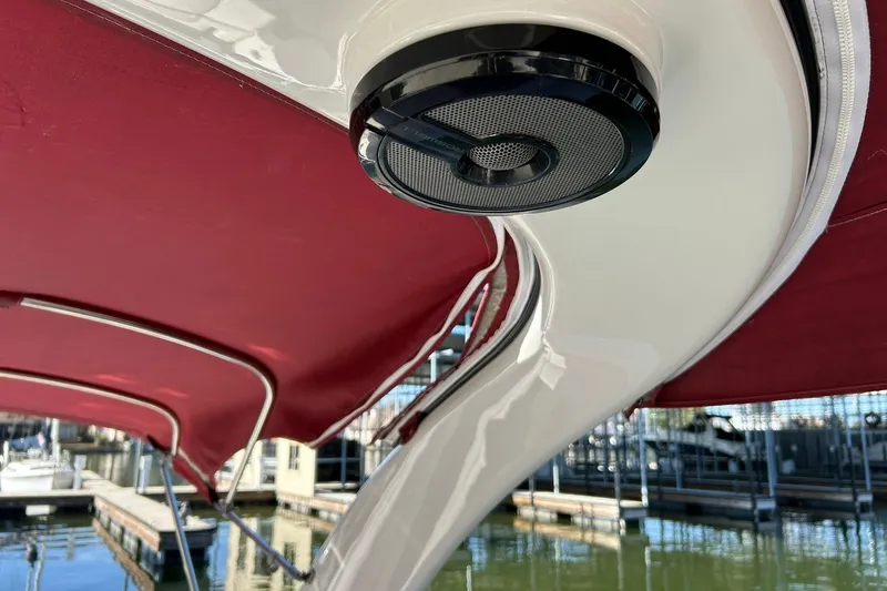 Slide: The Image of 2021 Bennington 25 RXSBA boat with red canopy and speaker detail. - 51